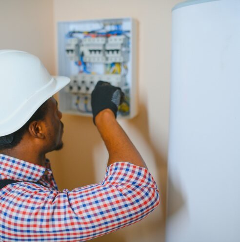 Electrician working on a distribution board