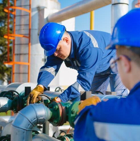 Technician working on pipelines