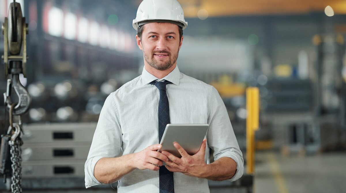 Engineer with a tablet in an industrial facility